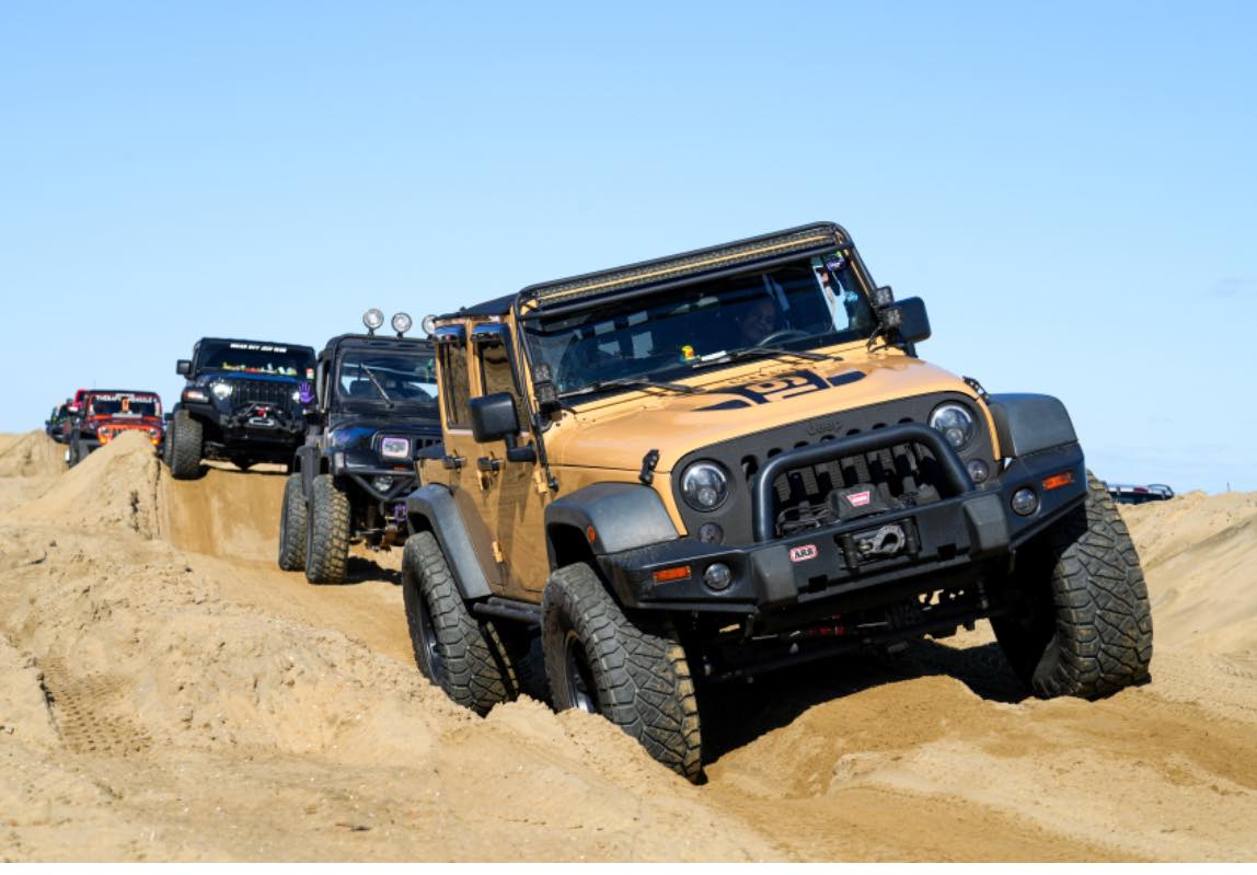 Jeeps riding on a course on the beach